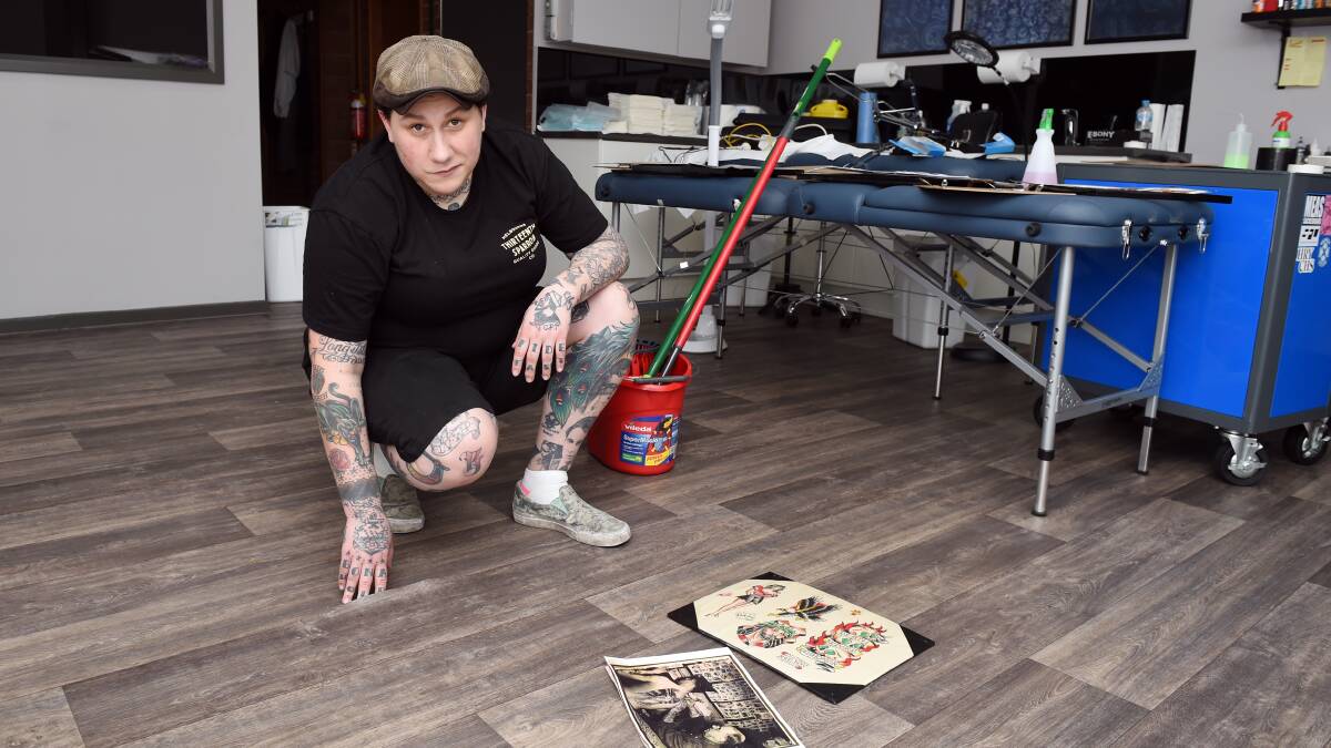 SHATTERED: Randi Cannik's tattoo parlour was damaged by floods over the weekend. Picture: Kate Healy. 