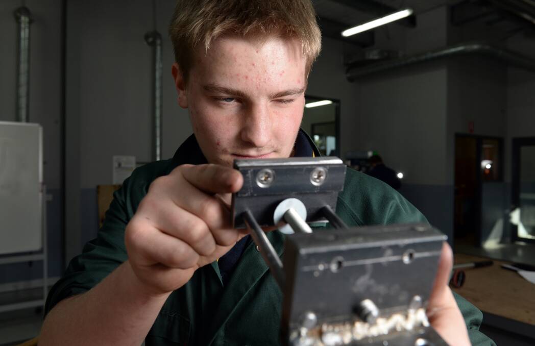  SKILL: Brendan Thomas, year 11 from Ballarat Christian College checks out on of the components at Regional VET Engineering WorldSkills competition. Picture: Kate Healy 