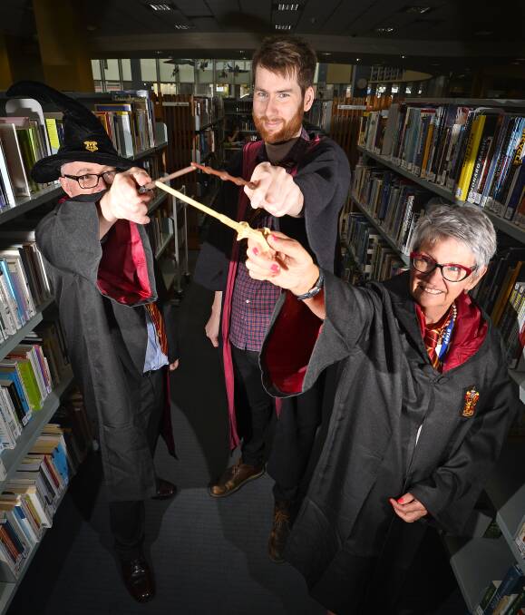  WEAVING THEIR MAGIC: Ballarat Library staff Ross Cummings, Stuart Scott and Jeni Lawrence get set in preparation for their annual Potter fest where hundreds of fans converge to delight in all things J.K. Rowling. Photo: Dylan Burns