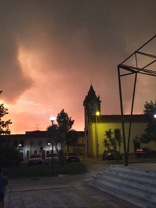 Ominous smoke clouds hang above Portuguese  towns. Picture Caleb Cluff