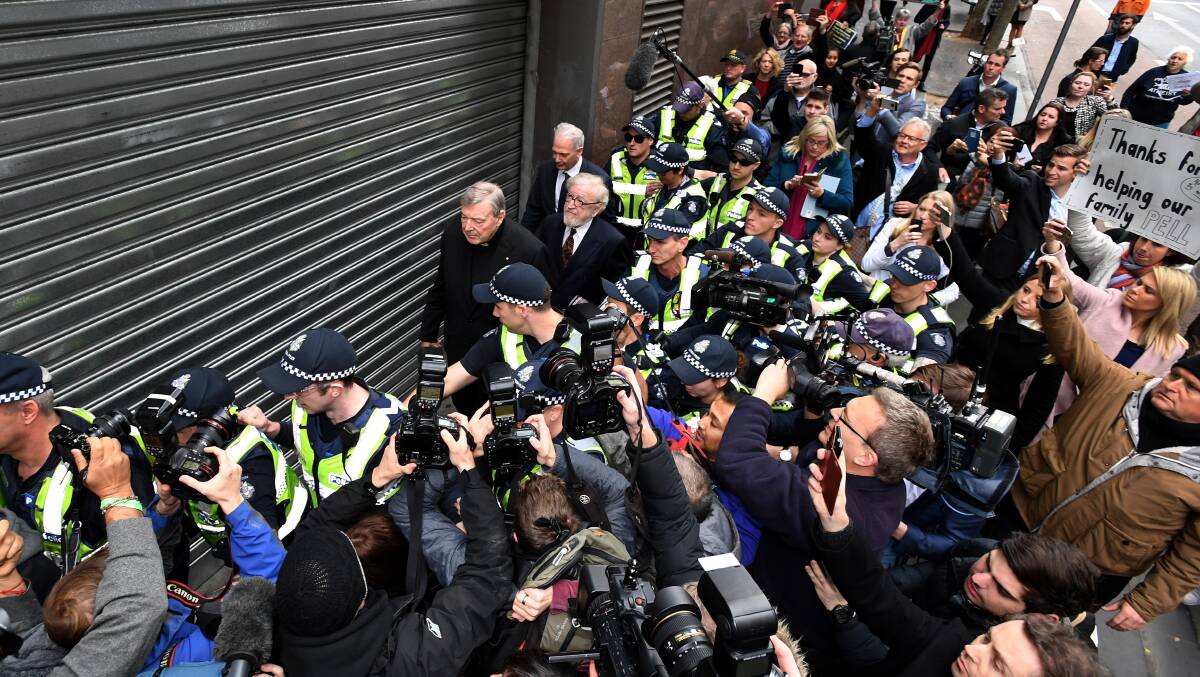 Cardinal Pell appears at court last year provoking unprecedented media interest