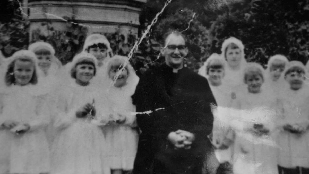 MISPLACED TRUST: Serial pedophile Gerald Ridsdale pictured with first communicants in a time when priests held unquestioned power and trust in the community.   