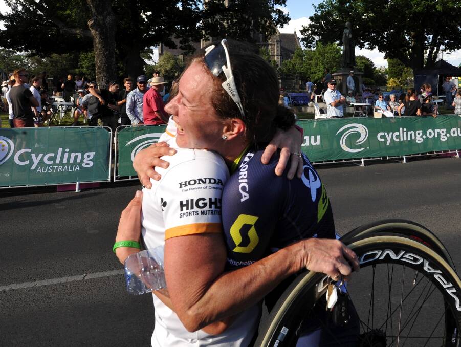 JUBILATION: Jessica Allen gets a congratulatory hug from her team after winning the women's criterium. Picture: Lachlan Bence