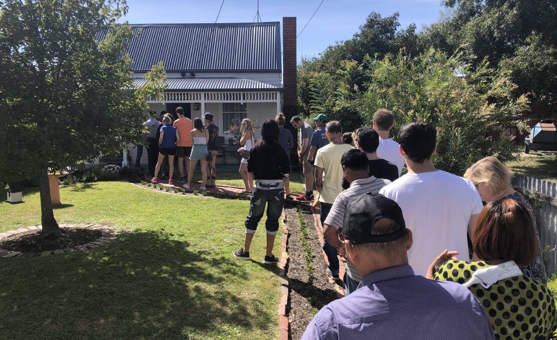 Open for inspection had them queuing up in Ballarat on a beautiful and busy weekend in real estate. Picture: Nicole Cairns