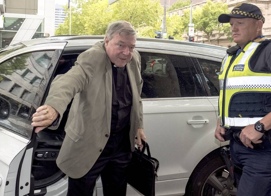 Cardinal Pell arives at court on Tuesday