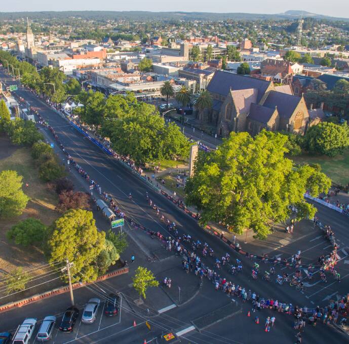 SPEED: The peloton tears into the top corner on one of the last laps of the Elite Men's Criterium. Image Skyline Drone Imaging