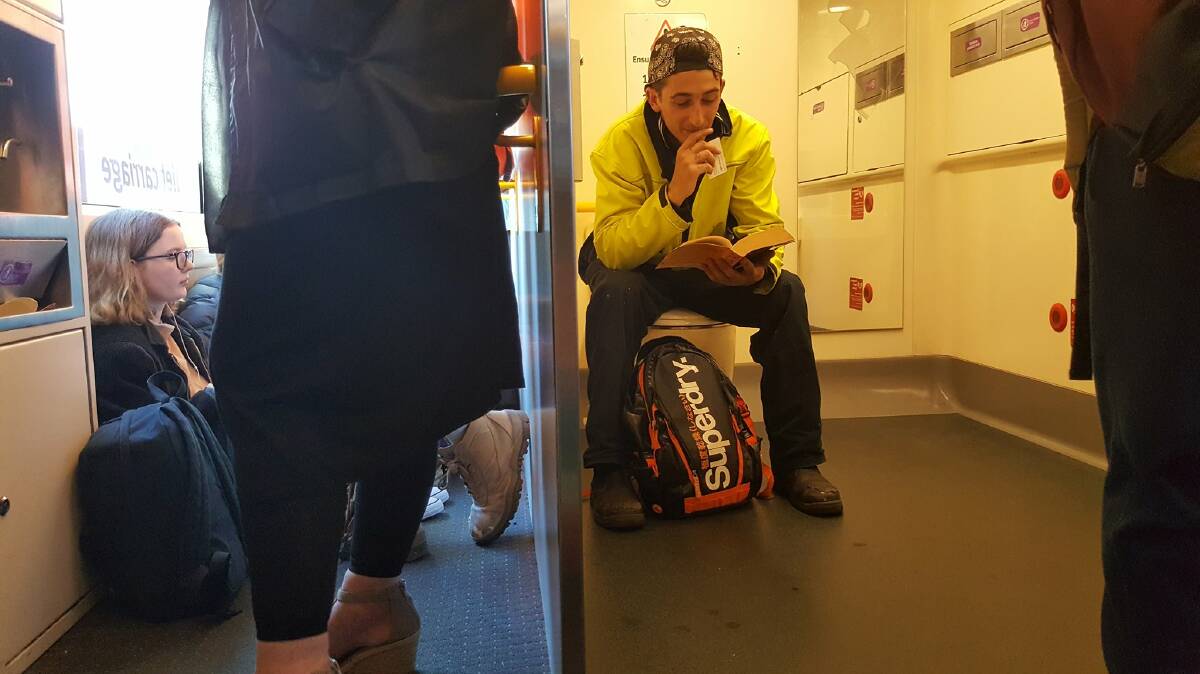 SIT ANYWHERE: A commuter's humourous view on what overcrowding drives V/line passengers to to find a seat.