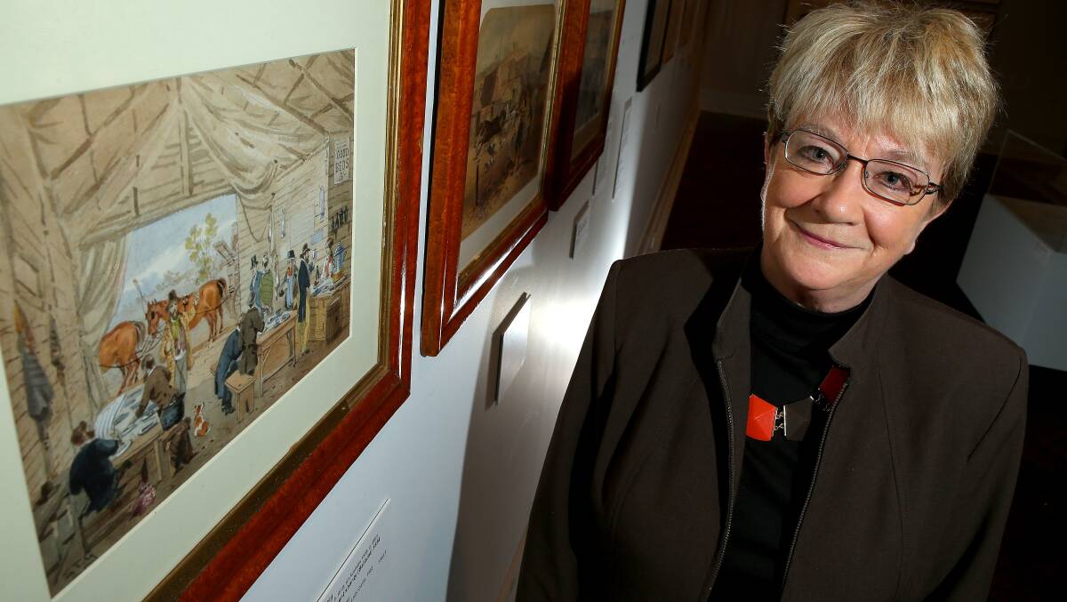 Author and lecturer on convict history Babette Smith poses for a photo in front of an artwork by ST Gill at the Gallery of Ballarat on July 4, 2016 in Ballarat, Australia.  