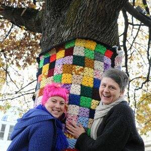Knit wits: Yarn bombers Steph Wallace and Jenny Laing add some colour to the streets. Picture: Zhenshi van der Klooster