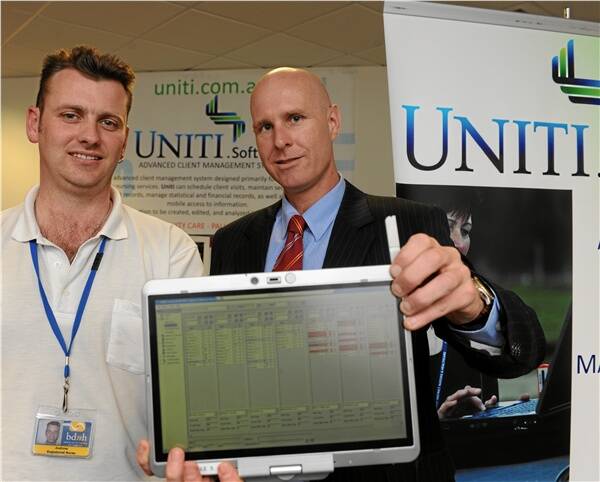 VISION: Ballarat District Nursing and Healthcare nurse Andrew Fraser looks at the new software with Uniti software manager Dean Parish.