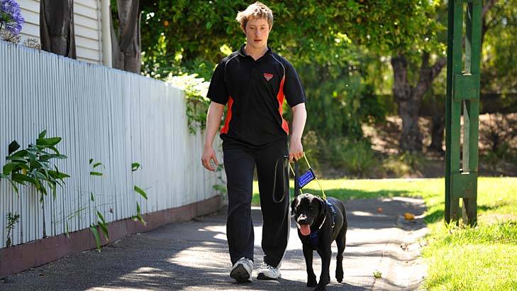 Andrew Close walks with his new guide dog, Orca.