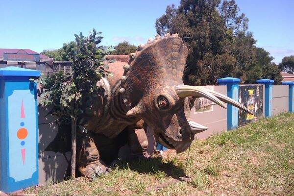 The tricerotops statue, once seen pummelling the wall, is now missing from Ballarat's Gold Rush Mini Golf.