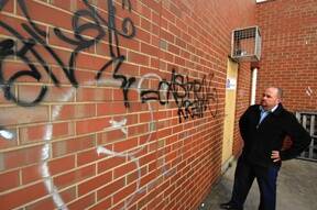 ILLEGAL: Ballarat City Councillor Des Hudson inspects some graffiti in a lane between Armstrong and Doveton streets.