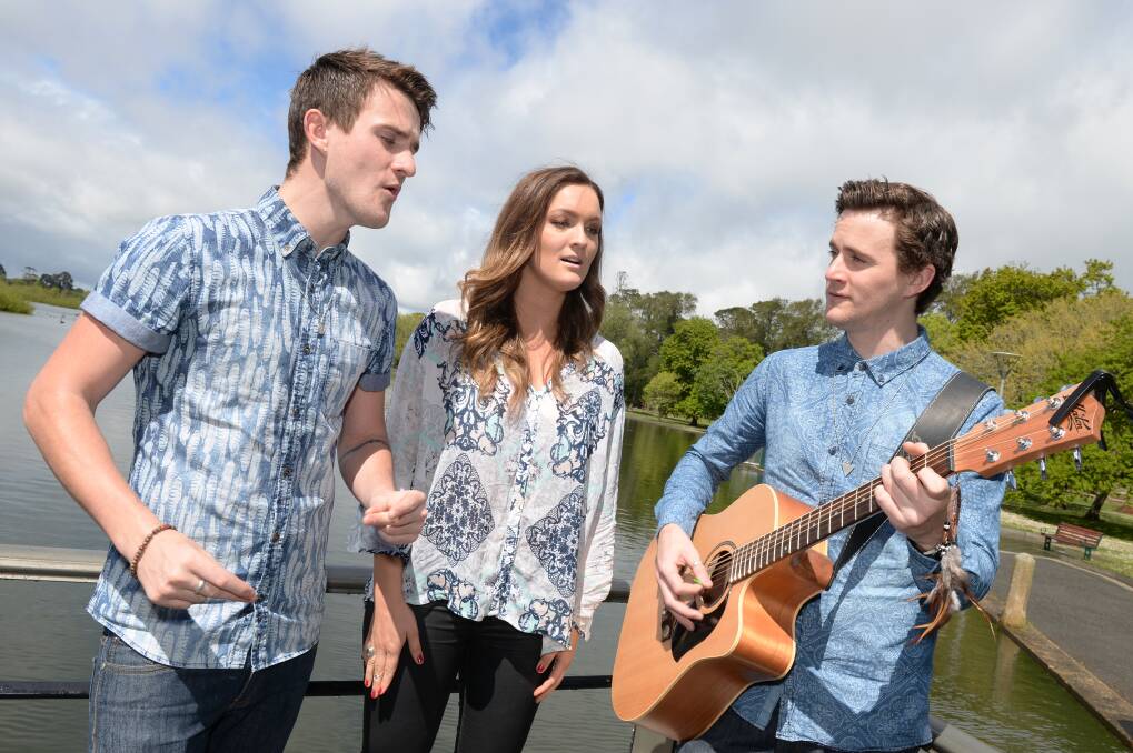 On song: Imogen Brough, centre, with Gabriel and Michael Saalfield, warming up for Springfest. PICTURE: KATE HEALY
