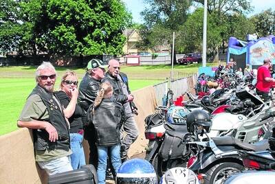 REST STOP: Riders at City Oval at the end of the toy run.