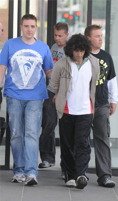 COURT: Plain-clothed police officers with Tony Bazzano, 45, second from right,  at Ballarat Magistrates Court yesterday where he faced drug charges following his arrest earlier in the day.
