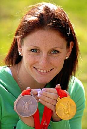 MEDAL HAUL: Ballarat swimmer Shayne Reese, with her prized gold and bronze medals from the Beijing Olympics, says she is ready for a well-earned rest.