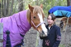 SADDENED: Tianni Donald with her horse Dory, who were due to begin pony lessons soon, but the theft of riding equipment has put a stop to that.