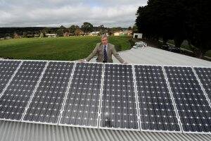 WISE: Friends of Royal Park vice-president David Lyle unveils the solar panels installed on the roof of the renovated clubrooms. Picture: Jeremy Bannister.