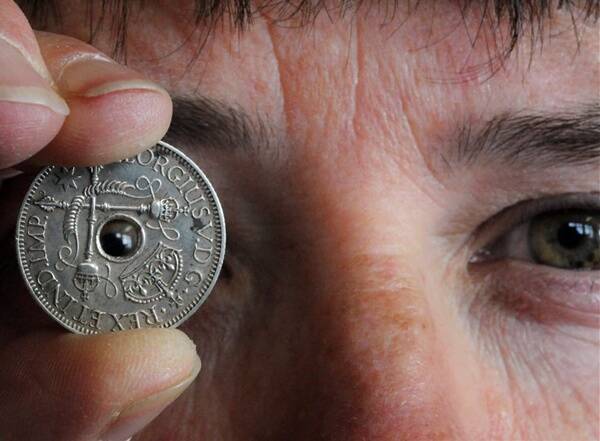 ENTHUSIAST: Long-time collector Yvonne Cruickshanks with a rare PNG coin.