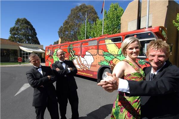 FROCKING UP FOR  GOOD CAUSE: On Track Foundation president, Craig Schepis, University of Ballarat's Colin Marshall and Penelope Irish and Soup Bus caretaker, Maurice Bentley get into the black-tie spirit of