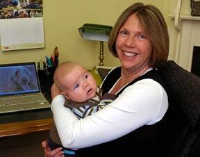 JUGGLING ACT: Ballarat MHR Catherine King at work in her home office with nine-week-old Ryan yesterday.