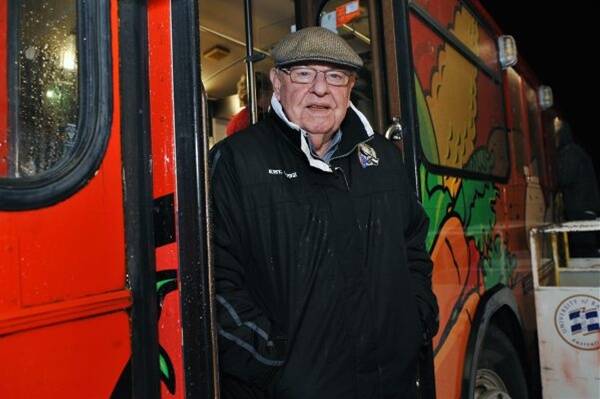 Father Bob on the step of the Soup Bus outside the Civic Hall.