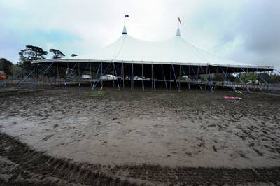 The aftermath of the Powderfinger concert with a lake of mud left behind in the North Gardens.