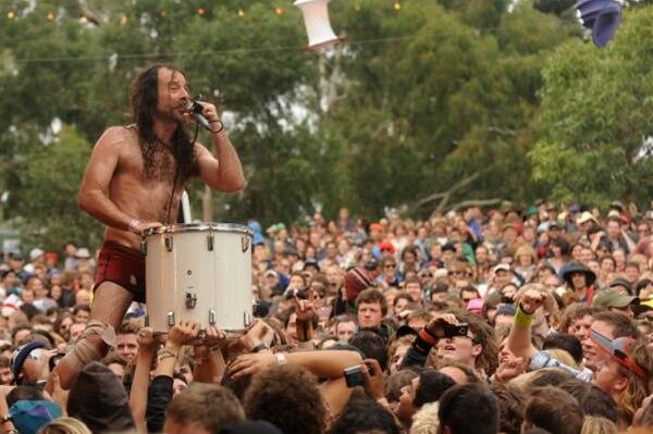 Monotonix singer Ami Shalev rides a mindrum kit above the crowd at this year's Golden Plains Music Festival. Picture: Andrew Kelly