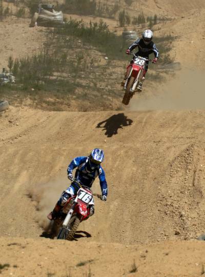 SYMMETRY: Motocross riders  Lewis Stewart  (16) and Lewis Woods  (28)  get in some practice ahead of  the Oceania Motocross Championships at Barrabool.