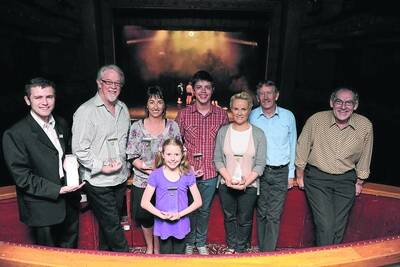 AND THE WINNERS ARE: BLOC theatre group members, from left, Matt Hustesite, Peter Tulloch, Carmel Flynn, Todd Jacobsson, Sallie Bourke-Muller, Peter Nethercote and Ian Govan with 10-year-old Ellie Carroll, front.