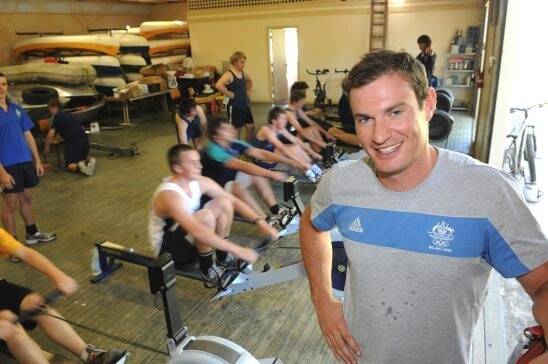 ENCOURAGING: Olympic rower James Marburg in front of a new crop of St Patrick's College rowers yesterday. Picture: Lachlan Bence
