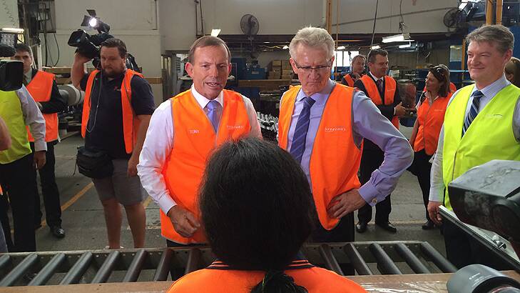 Prime Minister Tony Abbott and LNP candidate for Griffith Bill Glasson visit Breezair at Coorparoo. Photo: Cameron Atfield