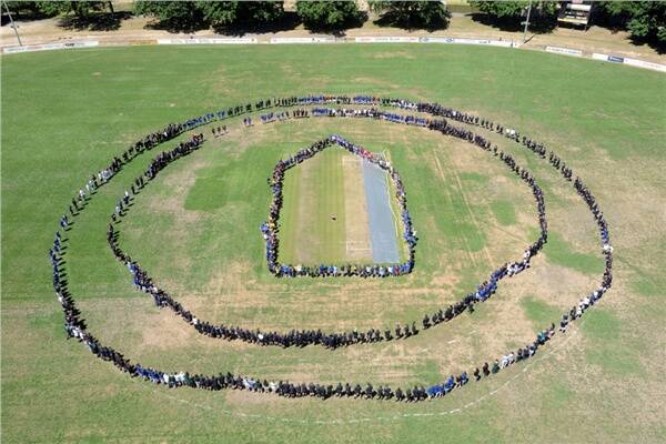 Caption: AWARENESS: Ballarat school children gather at the City Oval to highlight family violence for White Ribbon Day.
