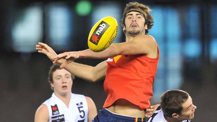 Brodie Grundy (centre) thrives on the physical nature of the game.