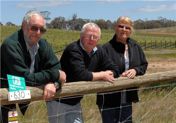 NO SLEEP: Greg Stafford, middle, with Redbank neighbours Kingsley and Thea Joyce, believe laws need to be introduced to regulate the operation of gas-powered scare guns used to frighten birds away from crops and orchards. Picture: Jeremy Bannister