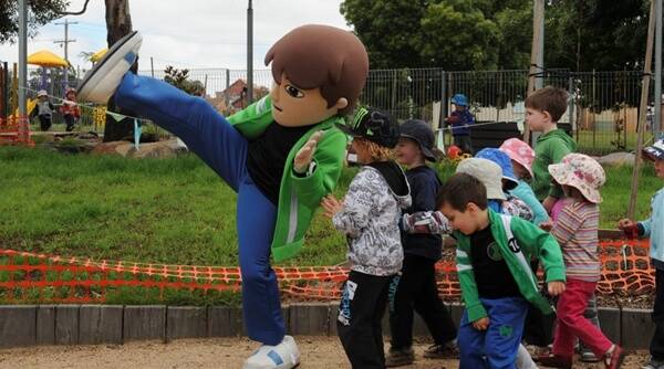 Attack: Alien-fighting favourite Ben 10 enlisted the children of Ballarat Child Care Co-operative yesterday during a fly-by visit ahead of a full live show planned for April. Picture: Lachlan Bence