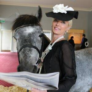 UNIQUE TIPSTER: Victoria Armstrong gets a race-day tip from Rocky the horse. Pictures: Lachlan Bence