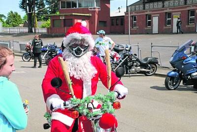 RED RIDER: Participants got into the spirit of Saturday’s 3BA Christmas Appeal toy run with decorations and costumes.
