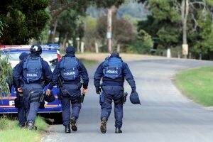 Officers at the scene of the Snake Valley siege. Picture: Jeremy Bannister.