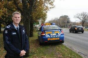 ACTION: Leading Senior Constable AJ Taylor at the corner of Sturt and Gillies streets yesterday.