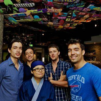 Staff at Paper Planes, Bondi Beach. From left, Matt and Tim Barge, Paul Capaldi, Chris Barge and in the middle head chef Jin Kung.