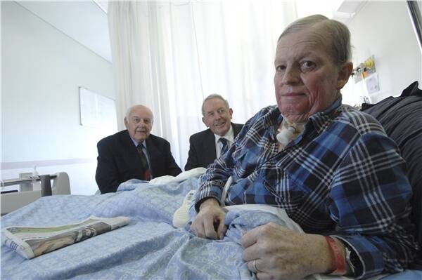 ADDED COMFORT: Freemasons Bill Hewitt and Bruce Bartrop with oncology patient Gerald Diamond at the Base Hospital.  The Freemasons have donated $5000 to the oncology unit.