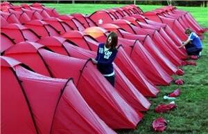 SHELTER: Volunteers erect tents at St Joseph's Primary School in the NSW Hunter Valley yesterday. - Picture by Kitty Hill