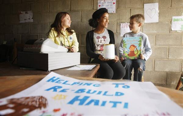 FUNDRAISERS: Baylee Dorchester, 10, Victoria Harding, 13 and Ryan Dorchester, 7, held a garage sale to raise money for victims of the Haiti earthquake. Picture: Daniel Hartley-Allen