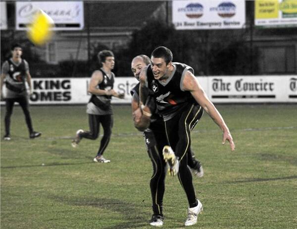 BACK AT HOME: Marc Greig puts some heat on teammate Matt Sharkey at Eureka Stadium last night. Sharkey got through this exercise okay, but was later ruled out with a wrist injury. The Roosters