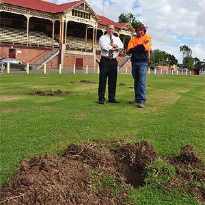 Central Goldfields Shire general manager of corporate and community services Wayne Belcher and CGS parks and gardens worker Russell LeTisser survey the damage to Princes Park. Picture: Maryborough Advertiser