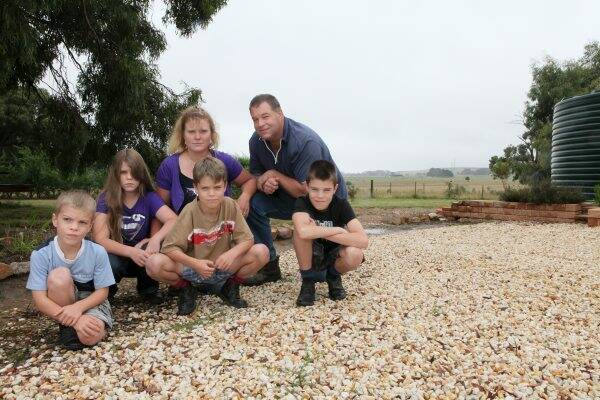 OPPPOSED: The O’Brien family on their property adjacent to the proposed windfarm site. Back left is Shelley and Marcus, and their children Jarrod, Travis, Hamish and Brooke. Picture: Adam Trafford