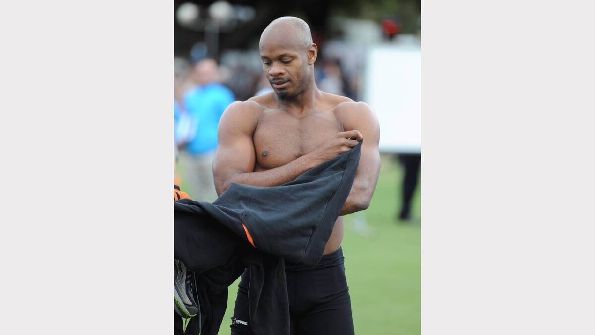 Asafa Powell contemplates the consequences of hamstring tightness at Stawell on Saturday.  PICTURE: LACHLAN BENCE