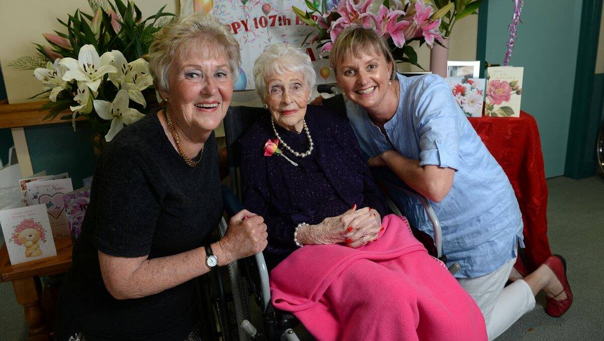 Cheer: Emma Woods celebrates her 107th birthday with her daughter Margaret Woods and granddaughter Andrea Weigall. PICTURE: ADAM TRAFFORD
